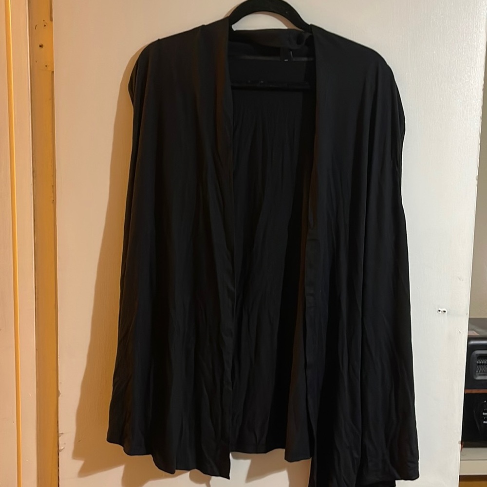 Sleeveless vest/cardigan. Black and NWT